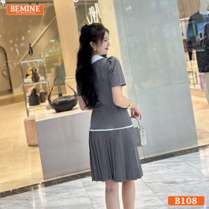 Chi tiết tùng váy xếp ly và các cúc áo trang trí trên chiếc đầm thiết kế BEMINE B108.