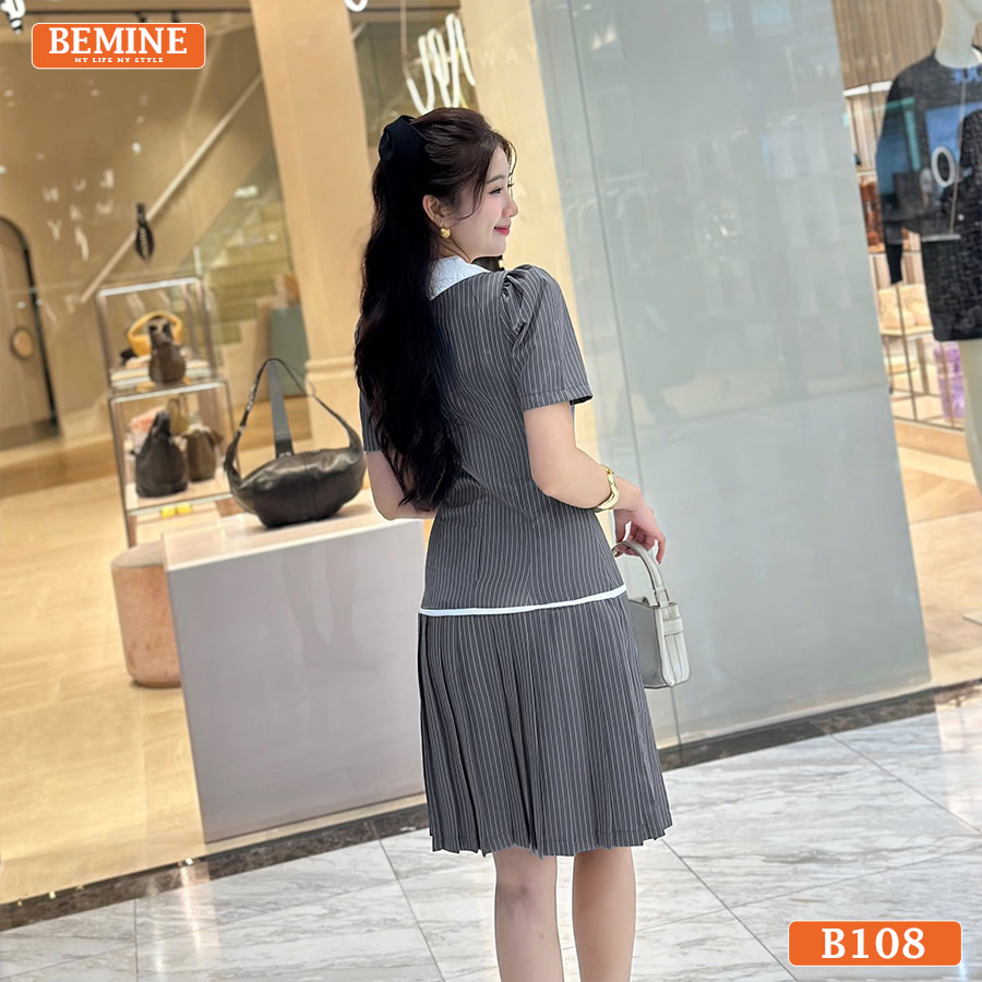 Chi tiết tùng váy xếp ly và các cúc áo trang trí trên chiếc đầm thiết kế BEMINE B108.