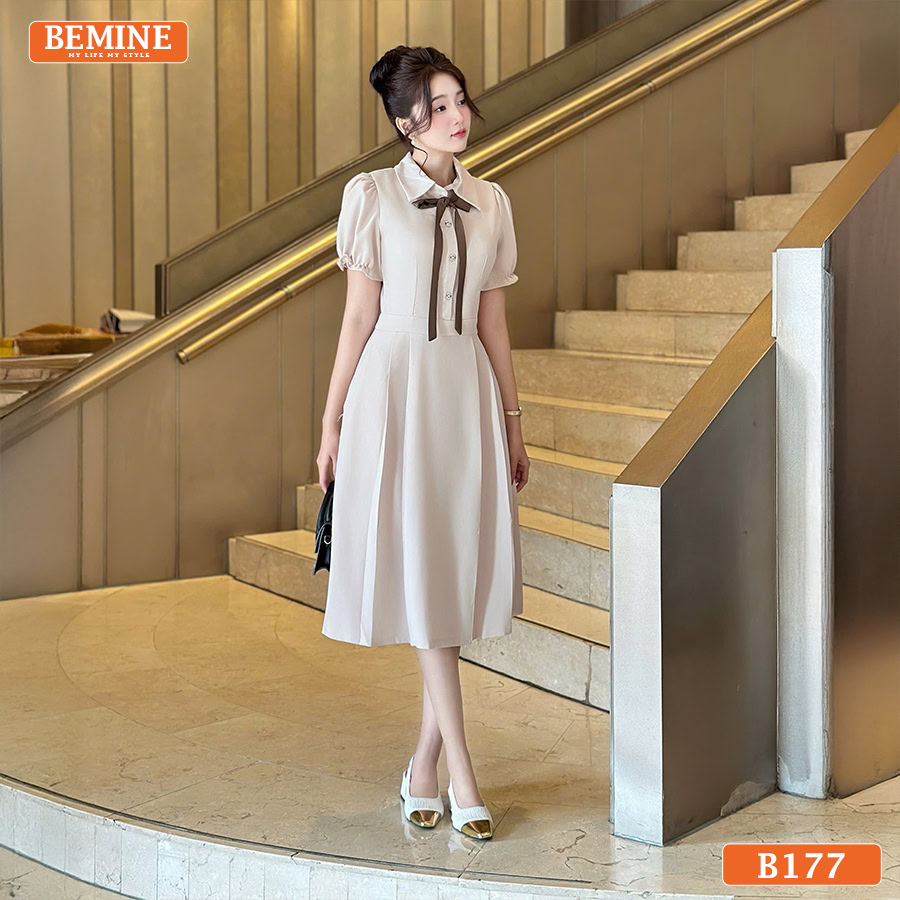 Mẫu đầm công sở BEMINE B177 với cổ sơ mi cổ điển, đai nơ thắt eo và dáng chữ A che khuyết điểm.