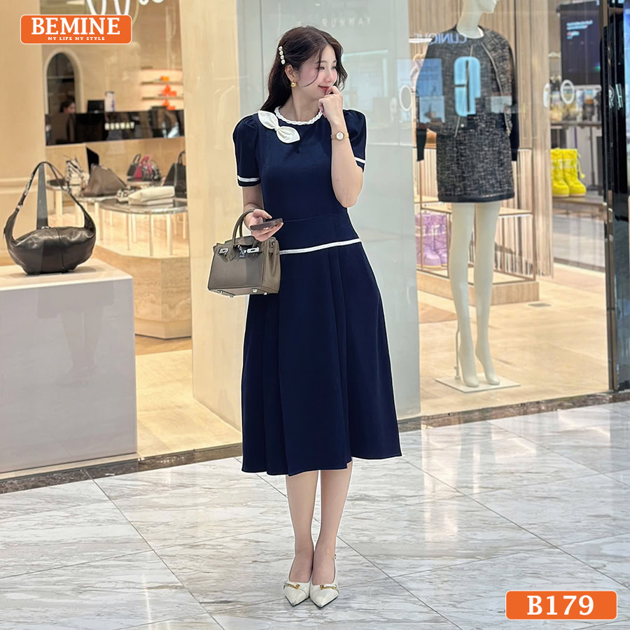 Đầm thiết kế BEMINE Dáng Chữ A Công Sở Cổ Tròn B179 Chi tiết tay áo ngắn/lỡ và cổ tròn của chiếc đầm thiết kế BEMINE B179.