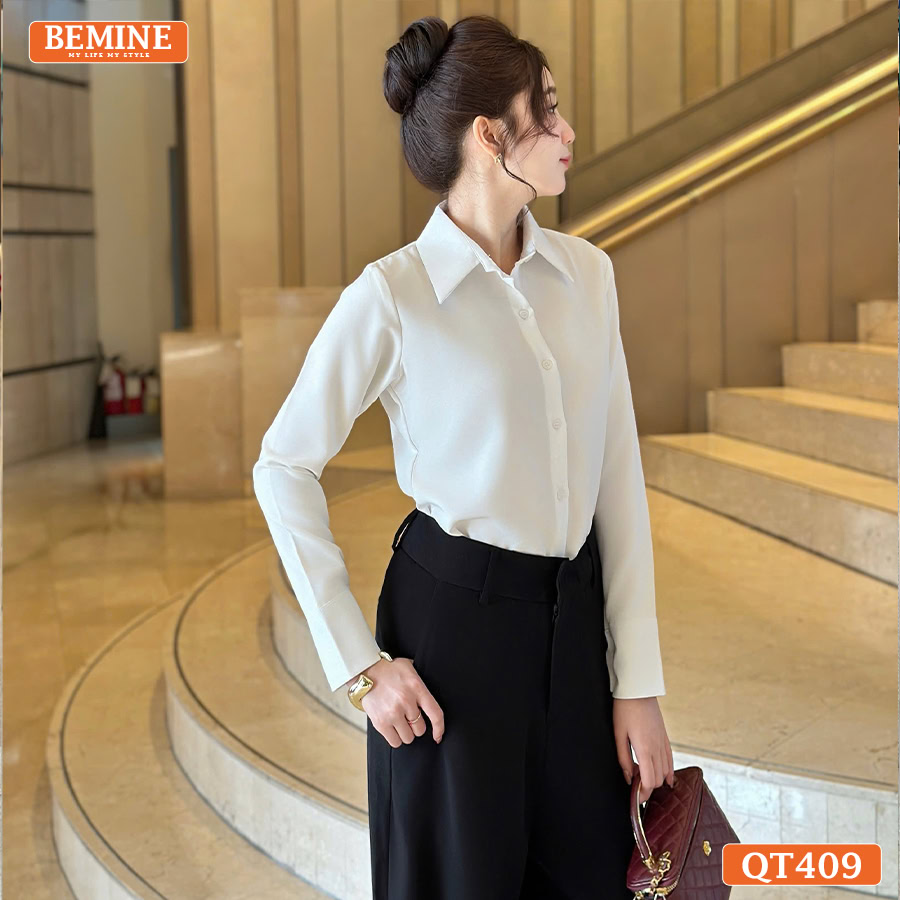 Ảnh cận cảnh chi tiết đường may và chất liệu vải của quần tây nữ BEMINE suông dài QT409 đen.