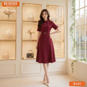 Góc chụp chi tiết đầm thiết kế BEMINE B143, tập trung vào sự kết hợp giữa cổ đức và đai eo.