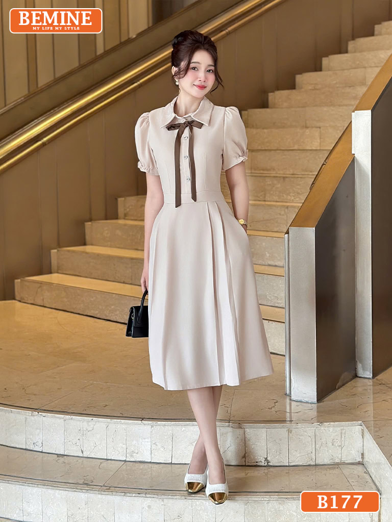 Đầm thiết kế BEMINE B177 dáng chữ A, cổ sơ mi, có nơ thắt trang nhã, phù hợp cho công sở.