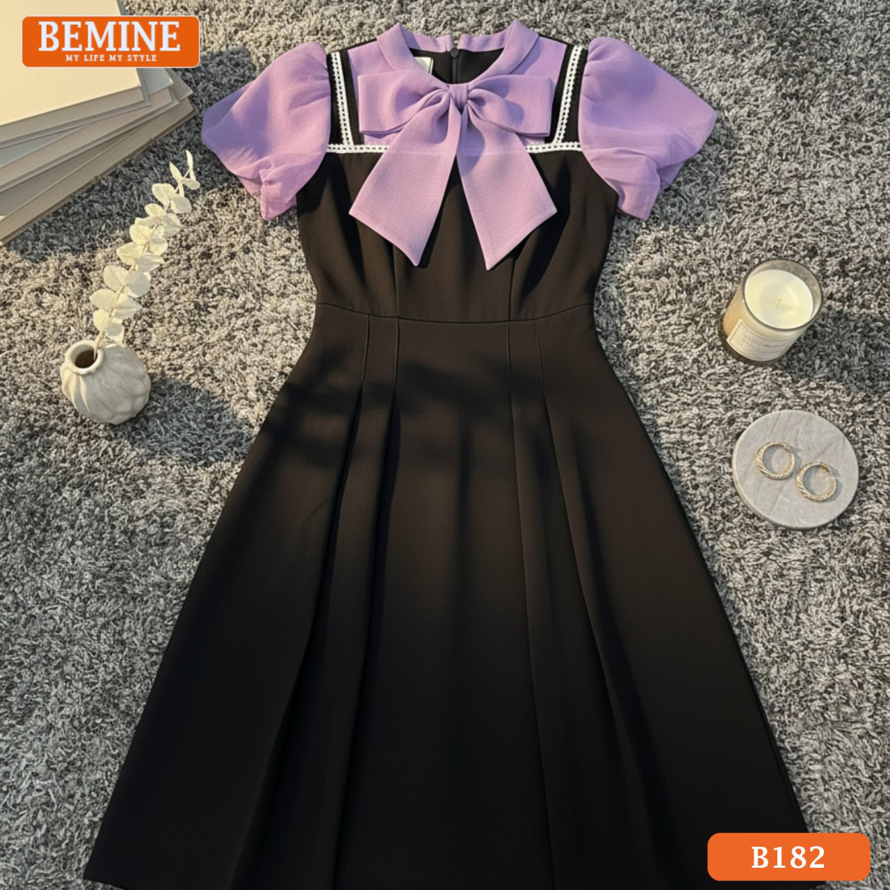 Chi tiết phối nơ giả yếm điệu đà trên nền cổ trụ của mẫu đầm công sở BEMINE B182 mới nhất.
