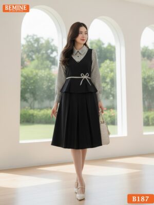 Người mẫu mặc đầm thiết kế BEMINE B187 dáng chữ A, cổ sơ mi caro, phong cách trẻ trung chuyên nghiệp.