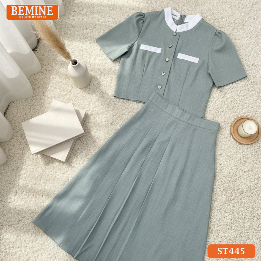 Góc chụp chi tiết set BEMINE ST445, tập trung vào thiết kế cổ trụ và độ rũ của dáng váy dài.