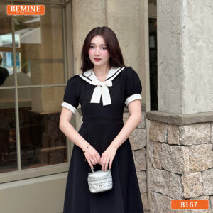 Người mẫu diện đầm BEMINE B167 màu đen dáng chữ A, phù hợp cho cả đi làm và dạo phố.