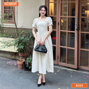 Mẫu đầm công sở BEMINE B203 cổ vuông đính hoa, mang lại vẻ ngoài duyên dáng và nữ tính.