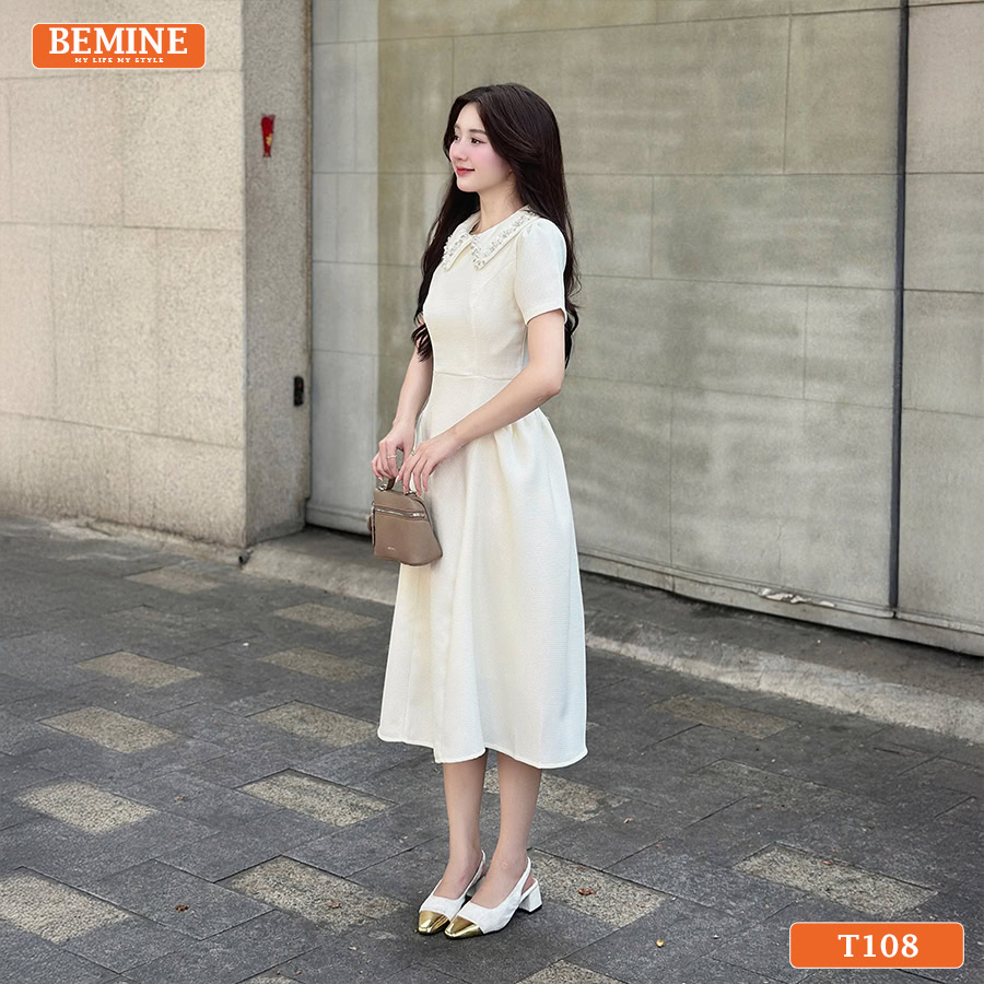 Mẫu đầm tiệc BEMINE T108 thiết kế cổ đức phối đính đá tinh xảo, tạo vẻ ngoài quý phái.
