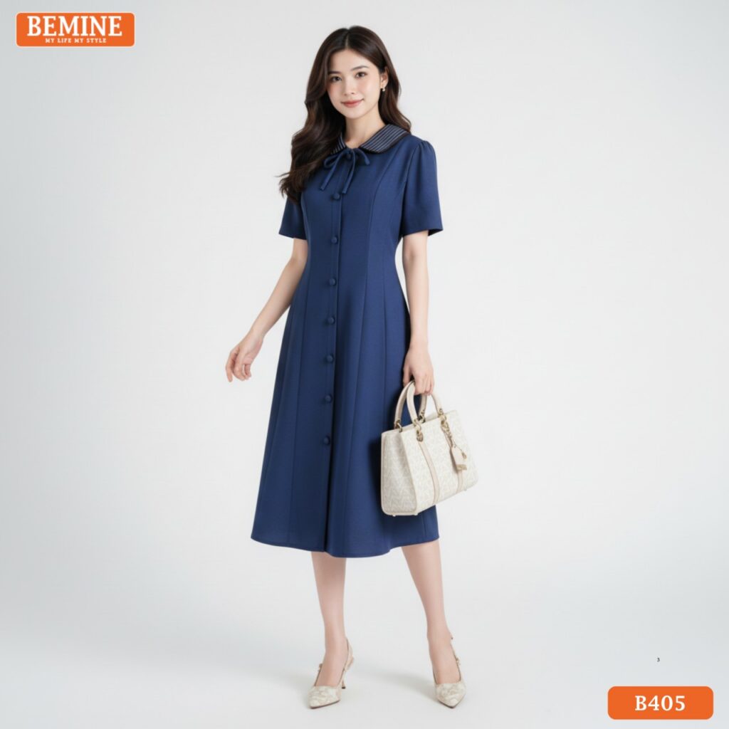 Ảnh cận cảnh chi tiết cổ sen và đường may sắc sảo trên chất liệu vải cao cấp của đầm BEMINE B405.