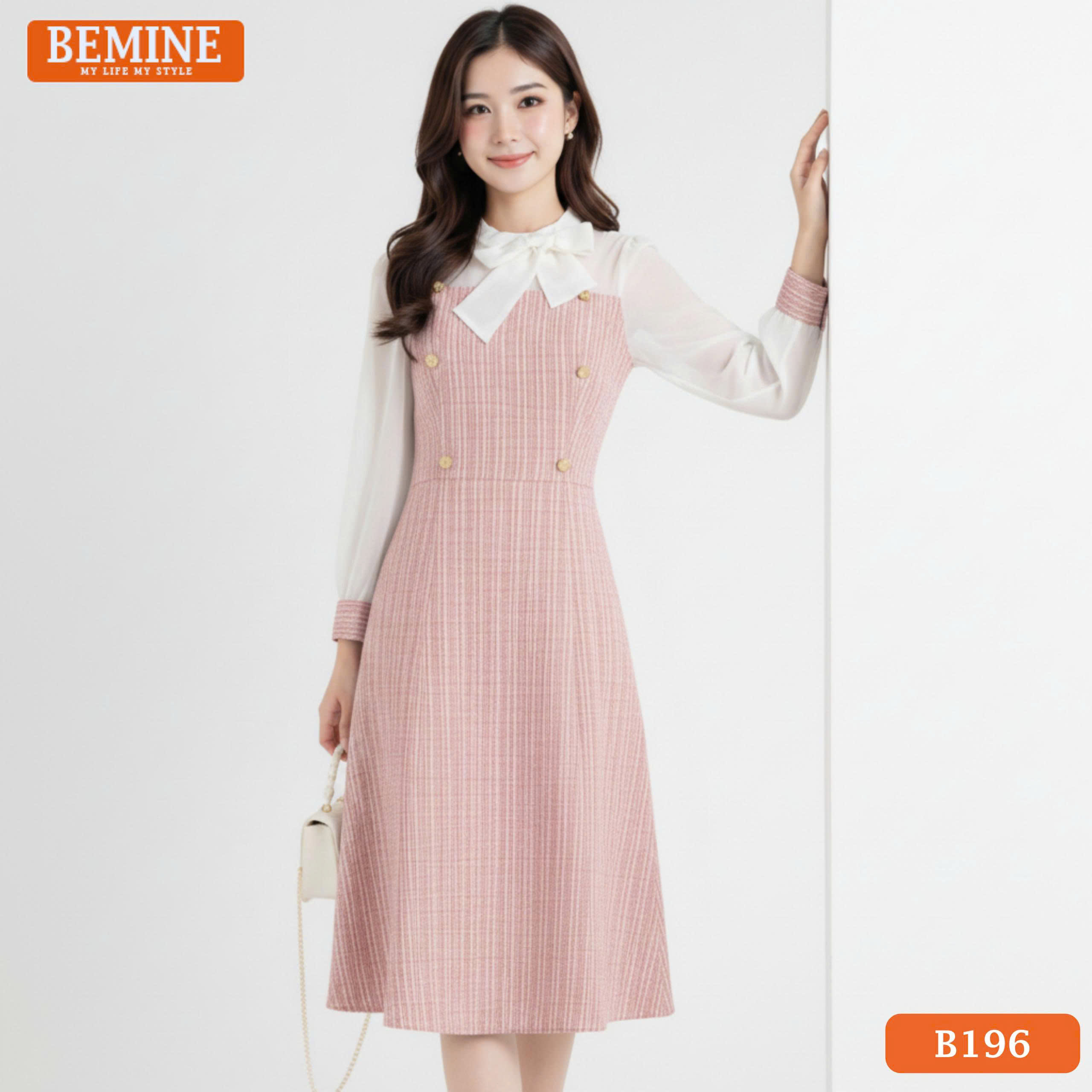 Ảnh cận cảnh chi tiết vải tơ cao cấp ở phần tay áo phối cùng cổ tròn của đầm BEMINE B196 hồng.