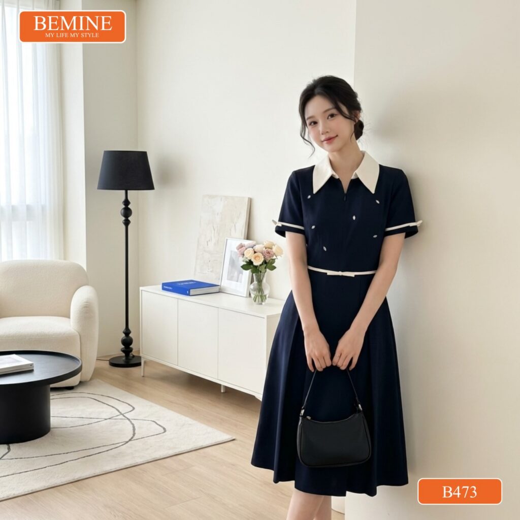 Người mẫu diện đầm BEMINE B473 đi làm chuyên nghiệp.