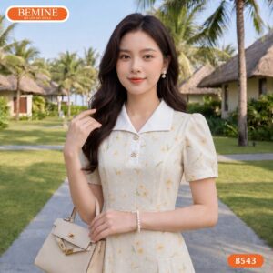 Người mẫu diện đầm chữ a cổ sơ mi họa tiết hoa BEMINE B543.