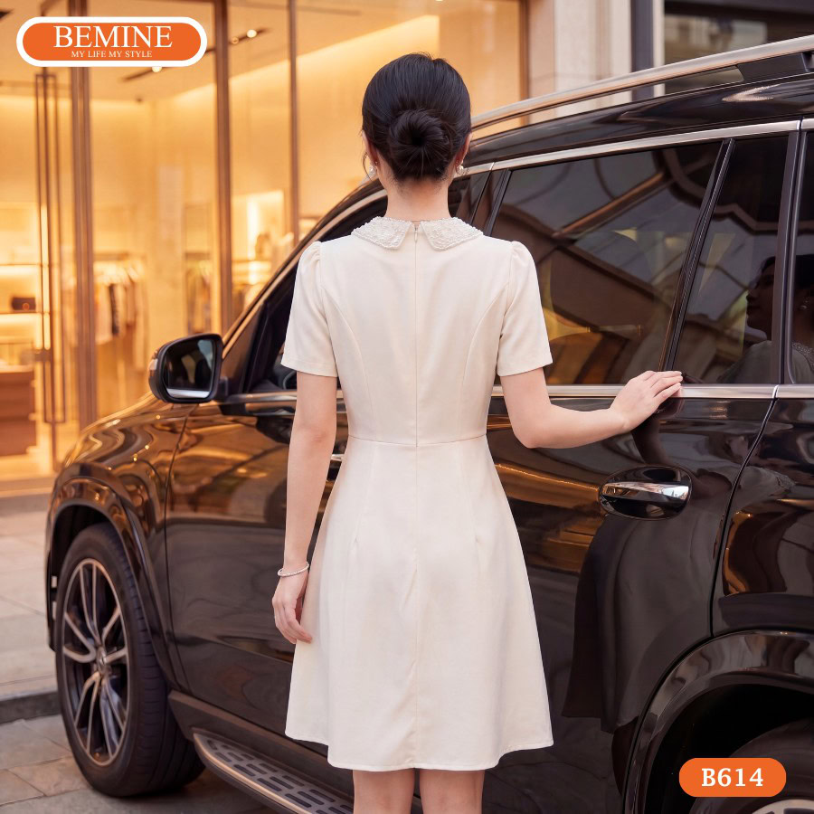 Đầm thiết kế BEMINE cổ sen đính cườm dáng ngắn B614 5 Mẫu đầm dáng ngắn BEMINE B614 giúp tôn dáng và che bụng hiệu quả.