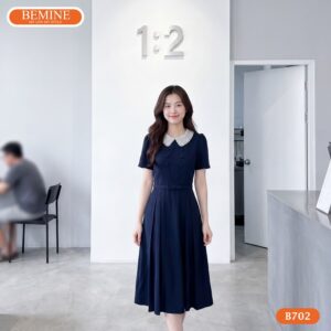 Người mẫu diện đầm chữ a cổ sen đính cườm BEMINE B702.